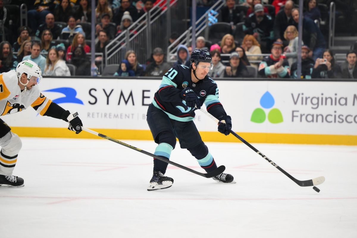 Jan 25, 2025; Seattle, Washington, USA; Seattle Kraken right wing Eeli Tolvanen (20) shoots the puck against the Pittsburgh Penguins during the first period at Climate Pledge Arena. Mandatory Credit: Steven Bisig-Imagn Images