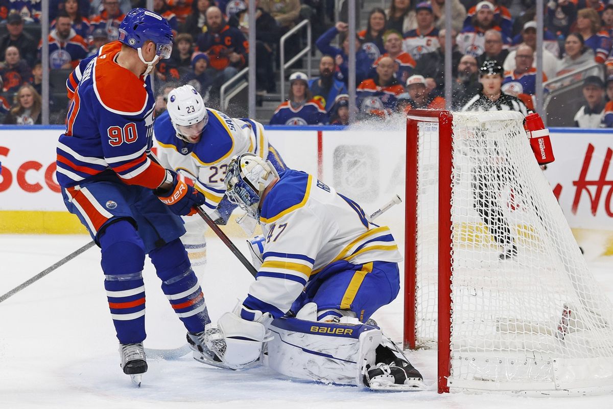 Jan 25, 2025; Edmonton, Alberta, CAN; Buffalo Sabres goaltender James Reimer (47) makes a save on Edmonton Oilers forward Corey Perry (90) during the first period at Rogers Place. Mandatory Credit: Perry Nelson-Imagn Images
