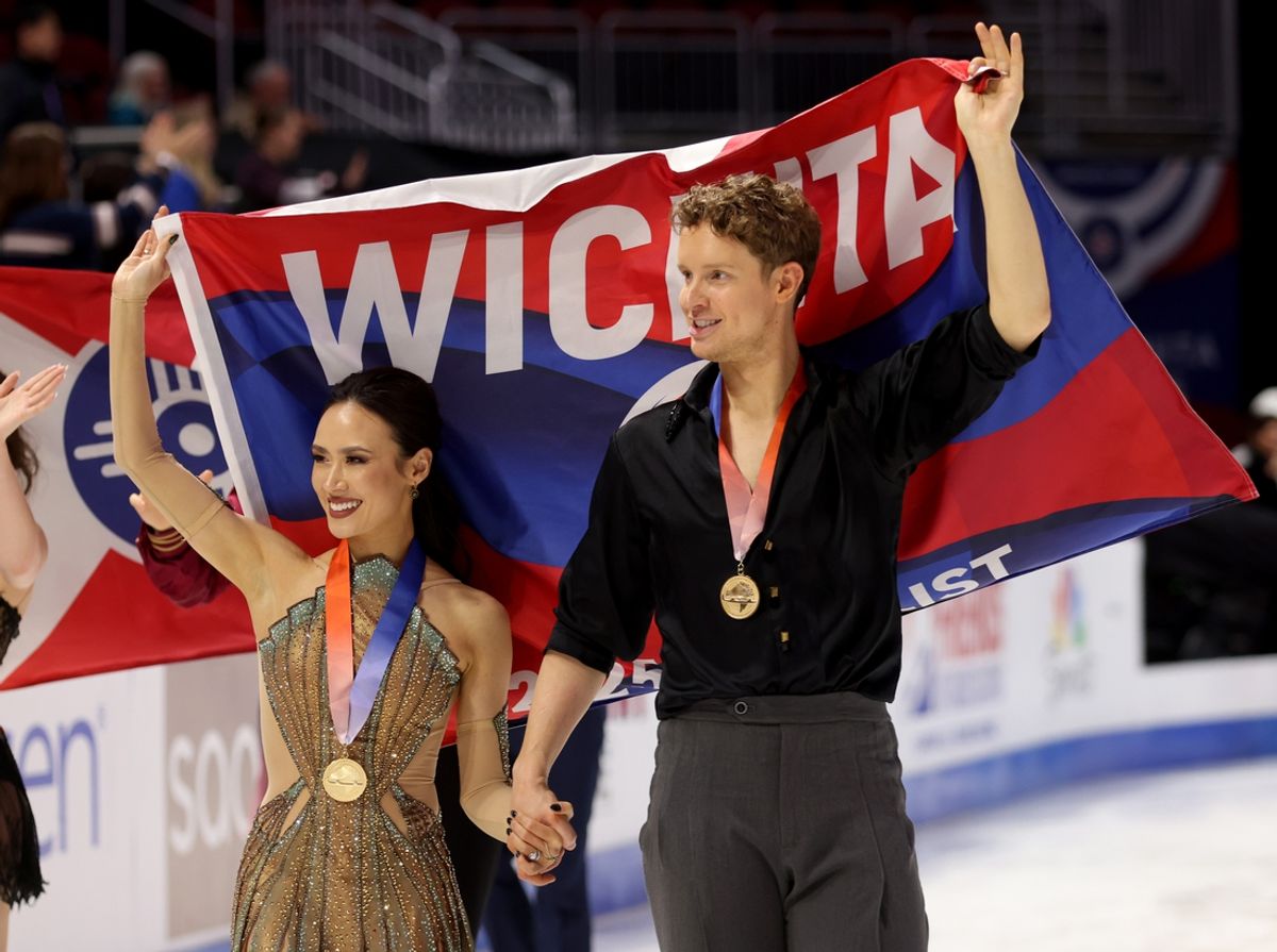 Jan 25, 2025; Wichita, Kansas, USA; Madison Chock and Evan Bates celebrate after winning the 2025 U.S. Figure Skating Championships ice dance gold medal ceremony at INTRUST Bank Arena. Mandatory Credit: William Purnell-Imagn Images
