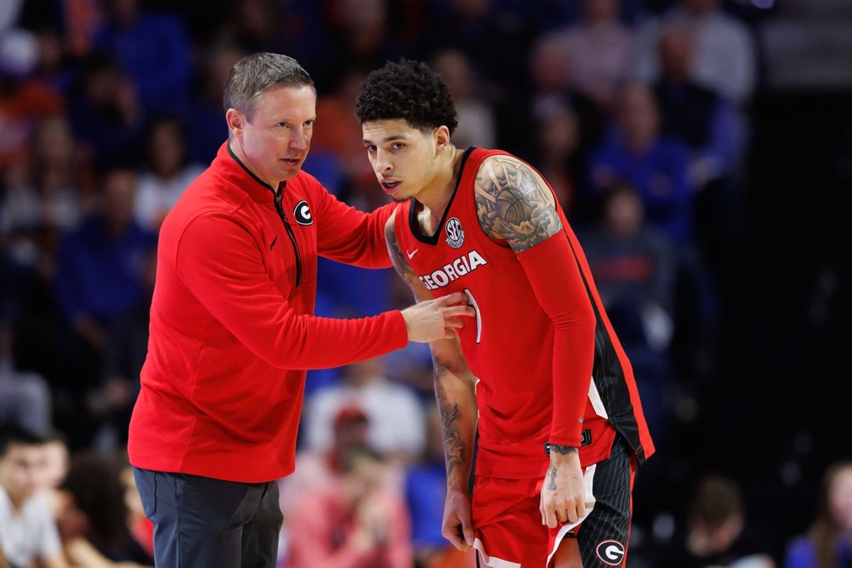 Jan 25, 2025; Gainesville, Florida, USA; Georgia Bulldogs head coach Mike White talks with Georgia Bulldogs guard Dakota Leffew (1) against the Florida Gators during the second half at Exactech Arena at the Stephen C. O'Connell Center. Mandatory Credit: Matt Pendleton-Imagn Images