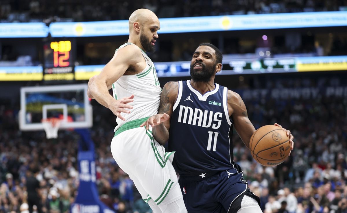 Jan 25, 2025; Dallas, Texas, USA;  Dallas Mavericks guard Kyrie Irving (11) drives to the basket as Boston Celtics guard Derrick White (9) defends during the first half at American Airlines Center. Mandatory Credit: Kevin Jairaj-Imagn Images