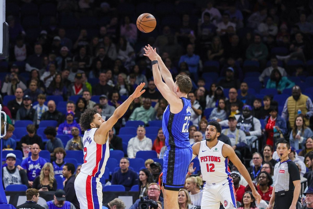 Jan 25, 2025; Orlando, Florida, USA; Orlando Magic forward Franz Wagner (22) shoots against Detroit Pistons guard Cade Cunningham (2) during the first quarter at Kia Center. Mandatory Credit: Mike Watters-Imagn Images