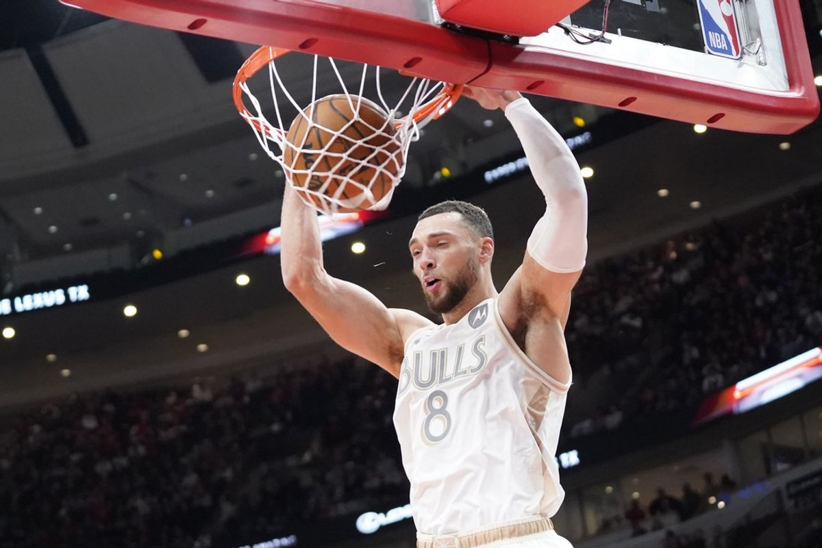 Jan 25, 2025; Chicago, Illinois, USA; Chicago Bulls guard Zach LaVine (8) dunks the ball against the Philadelphia 76ers during the first quarter at United Center. Mandatory Credit: David Banks-Imagn Images