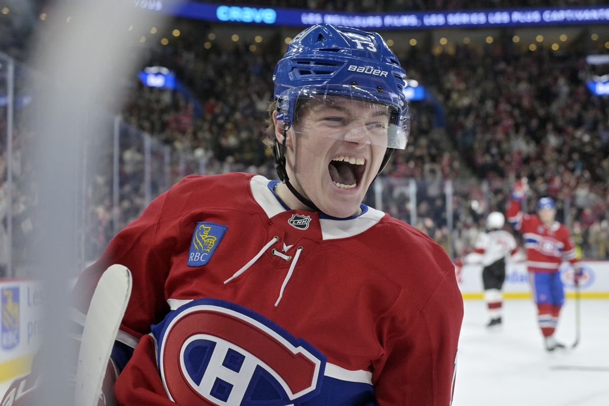 Jan 25, 2025; Montreal, Quebec, CAN; Montreal Canadiens forward Cole Caufield (13) celebrates after scoring a goal against the New Jersey Devils during the second period at the Bell Centre. Mandatory Credit: Eric Bolte-Imagn Images