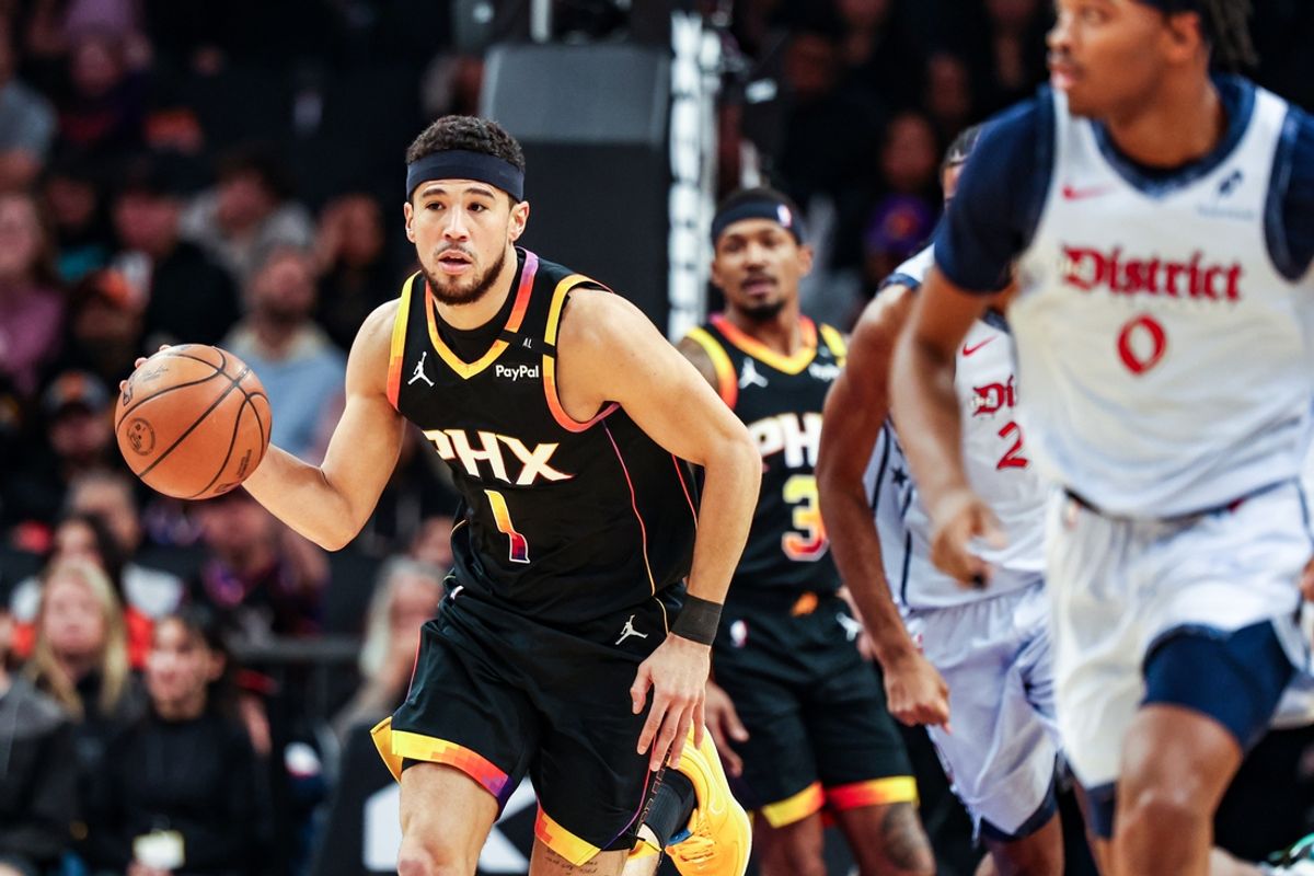 Jan 25, 2025; Phoenix, Arizona, USA; Phoenix Suns guard Devin Booker (1) dribbles the ball during the first quarter against the Washington Wizards at Footprint Center. Mandatory Credit: Aryanna Frank-Imagn Images