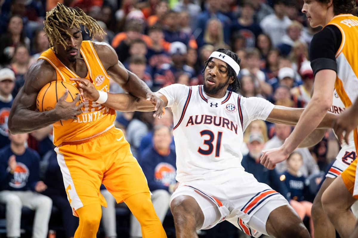 Tennessee Volunteers guard Jahmai Mashack (15) and Auburn Tigers forward Chaney Johnson (31) fight for a rebound as Auburn Tigers take on Tennessee Volunteers at Neville Arena in Auburn, Ala., on Saturday, Jan. 25, 2025. Auburn Tigers lead Tennessee Volunteers 22-20 at halftime.