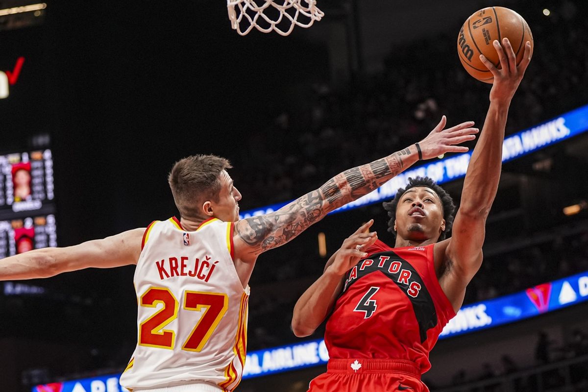 Jan 25, 2025; Atlanta, Georgia, USA; Toronto Raptors forward Scottie Barnes (4) shoots against Atlanta Hawks guard Vit Krejci (27) during the second half at State Farm Arena. Mandatory Credit: Dale Zanine-Imagn Images