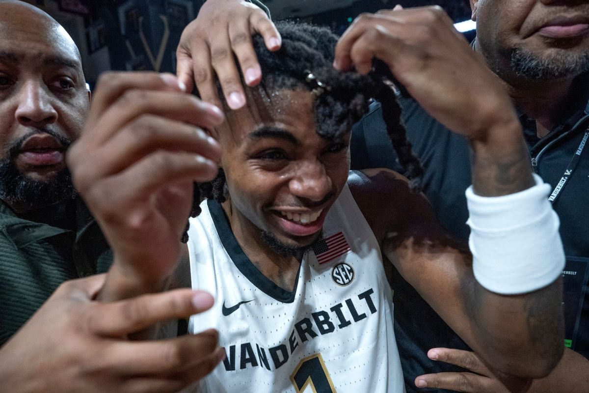 Vanderbilt Commodores guard Jason Edwards (1) is led off the court after beating the Kentucky Wildcats at Memorial Gym in Nashville, Tenn., Saturday, Jan. 25, 2025.