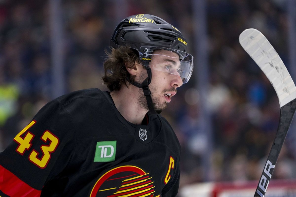 Jan 25, 2025; Vancouver, British Columbia, CAN; Vancouver Canucks defenseman Quinn Hughes (43) during a stop in play against the Washington Capitals in the first period at Rogers Arena. Mandatory Credit: Bob Frid-Imagn Images