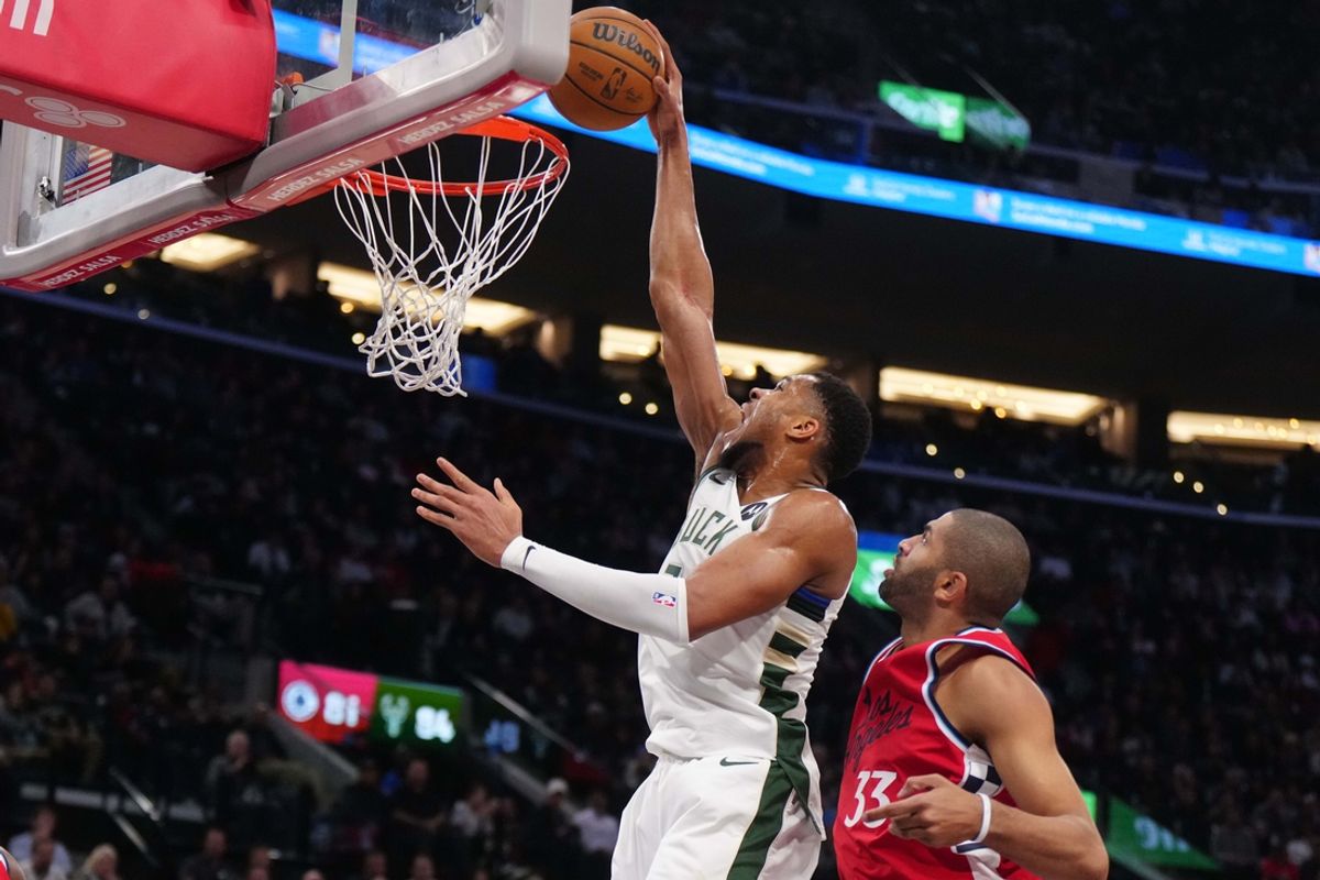 Jan 25, 2025; Inglewood, California, USA; Milwaukee Bucks forward Giannis Antetokounmpo (34) dunks the ball against Los Angeles Clippers forward Nicolas Batum (33)  in the second half at Intuit Dome. Mandatory Credit: Kirby Lee-Imagn Images