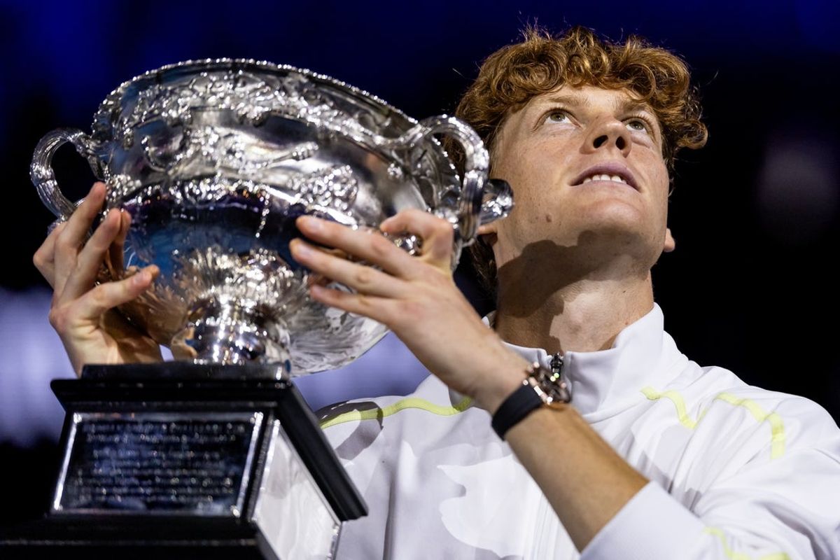 Jan 26, 2025; Melbourne, Victoria, Australia; Jannik Sinner of Italy celebrates with the Australian Open title during the prize presentation of the men's single at the 2025 Australian Open at Melbourne Park. Mandatory Credit: Mike Frey-Imagn Images