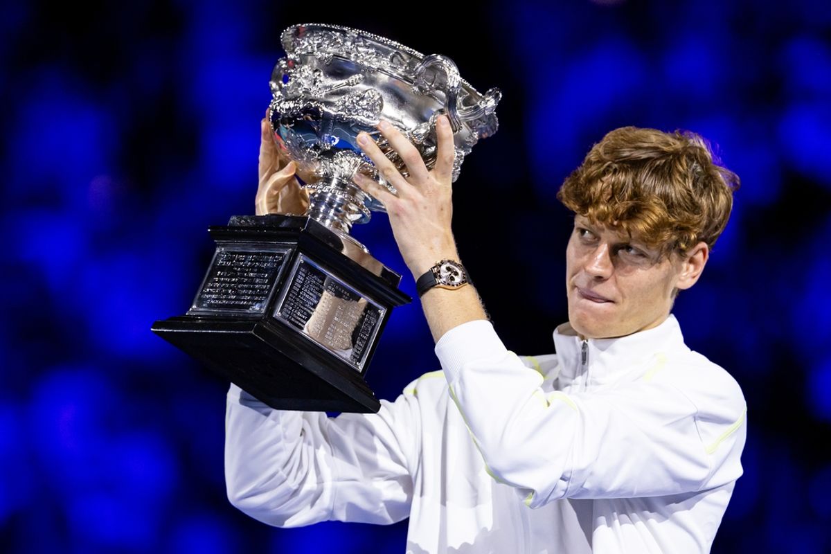 Jan 26, 2025; Melbourne, Victoria, Australia; Jannik Sinner of Italy celebrates with the Australian Open title during the prize presentation of the men's single at the 2025 Australian Open at Melbourne Park. Mandatory Credit: Mike Frey-Imagn Images