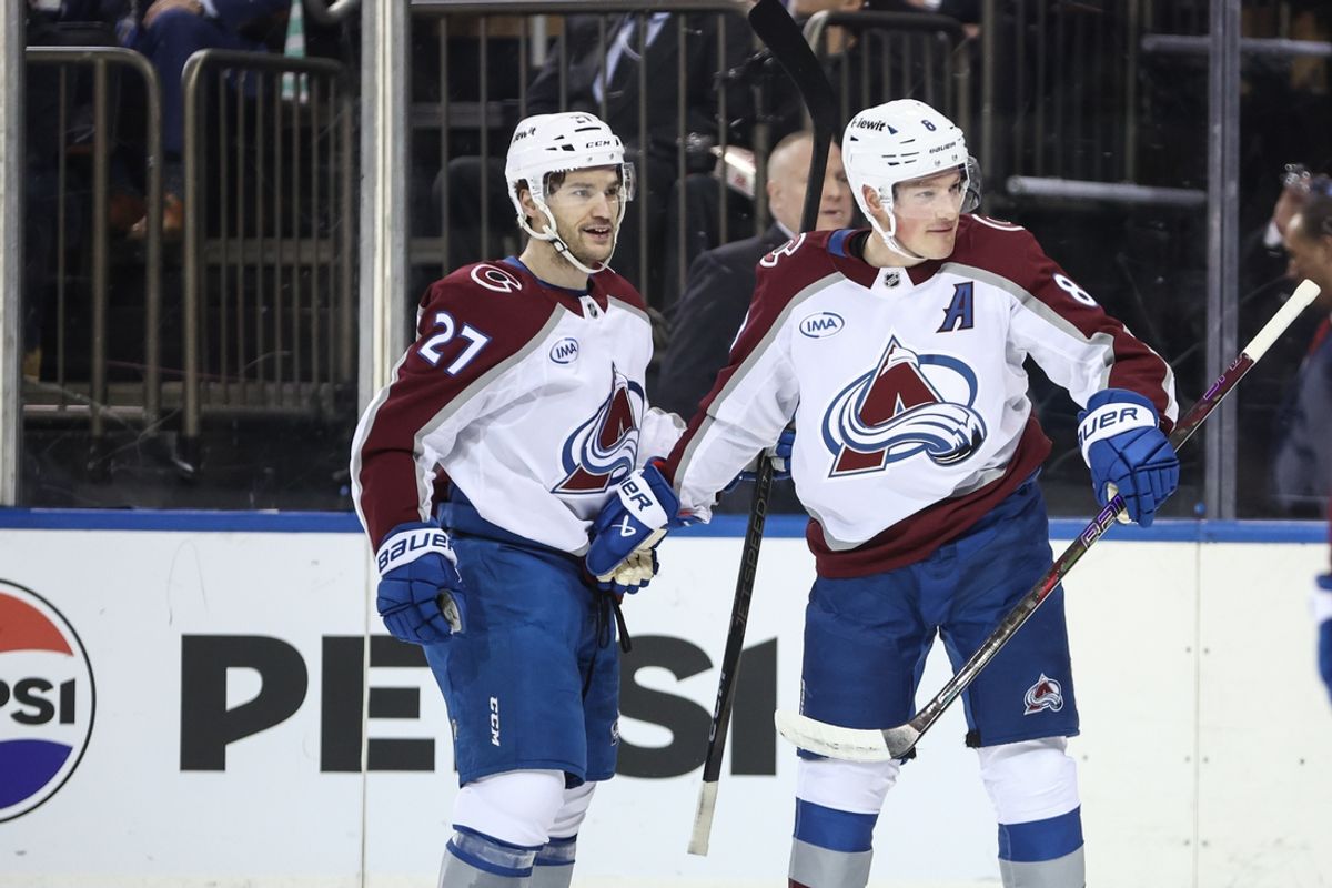 Jan 26, 2025; New York, New York, USA;  Colorado Avalanche defenseman Cale Makar (8) celebrates with left wing Jonathan Drouin (27) after scoring a goal in the first period against the New York Rangers at Madison Square Garden. Mandatory Credit: Wendell Cruz-Imagn Images