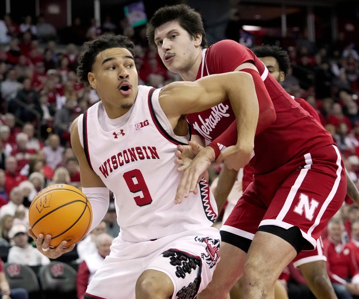 Wisconsin guard John Tonje (9) drive past Nebraska forward Berke Buyuktuncel (9) during the second half of their game Sunday, January 26, 2025 at the Kohl Center in Madison, Wisconsin. Wisconsin beat Nebraska 83-55.