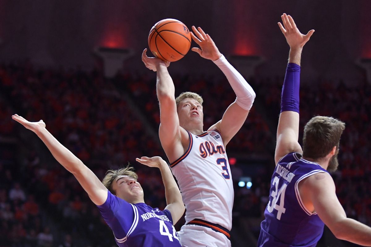 Jan 26, 2025; Champaign, Illinois, USA; Illinois Fighting Illini forward Ben Humrichous (3) drives to the basket between Northwestern Wildcats guard Angelo Ciaravino (44) and Matthew Nicholson (34) during the first half at State Farm Center. Mandatory Credit: Ron Johnson-Imagn Images