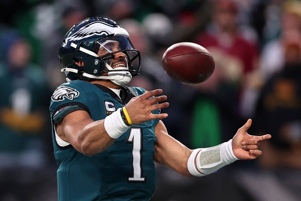 Philadelphia Eagles quarterback Jalen Hurts (1) celebrates after a touchdown against the Washington Commanders during the second half in the NFC Championship game at Lincoln Financial Field. Mandatory Credit: Bill Streicher-Imagn Images