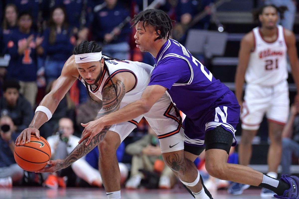 Jan 26, 2025; Champaign, Illinois, USA;  Northwestern Wildcats guard K.J. Windham (24) pressures Illinois Fighting Illini guard Kylan Boswell (4) during the second half at State Farm Center. Mandatory Credit: Ron Johnson-Imagn Images