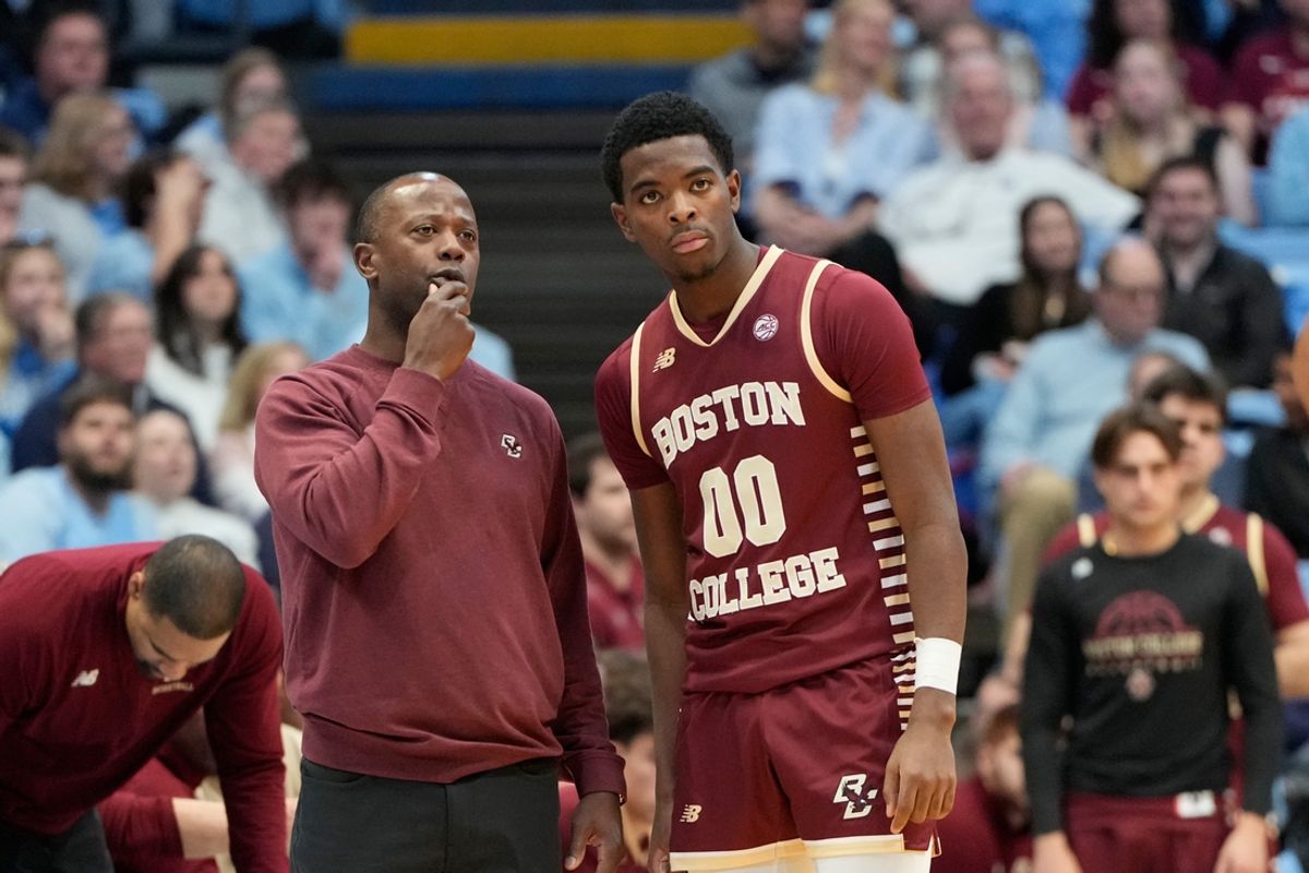 Jan 25, 2025; Chapel Hill, North Carolina, USA; Boston College Eagles head coach Earl Grant talks with guard Chas Kelly III (00) in the first half at Dean E. Smith Center. Mandatory Credit: Bob Donnan-Imagn Images