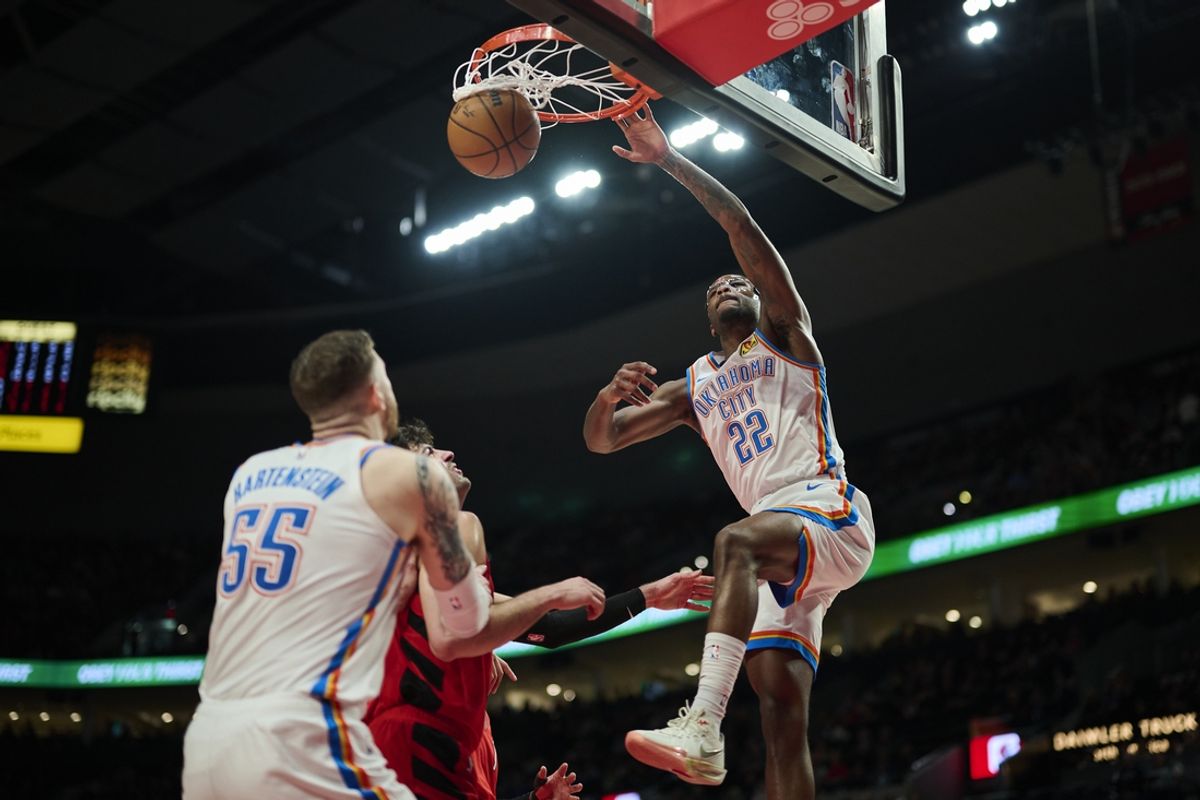 Jan 26, 2025; Portland, Oregon, USA; Oklahoma City Thunder guard Cason Wallace (22) dunks the basketball during the first half against Portland Trail Blazers forward Deni Avdija (8) at Moda Center. Mandatory Credit: Troy Wayrynen-Imagn Images