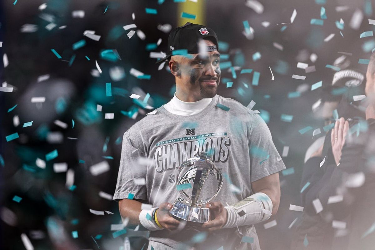 Jan 26, 2025; Philadelphia, PA, USA; Philadelphia Eagles quarterback Jalen Hurts (1) holds the NFC Championship trophy after a victory in the NFC Championship game against the Washington Commanders at Lincoln Financial Field. Mandatory Credit: Bill Streicher-Imagn Images
