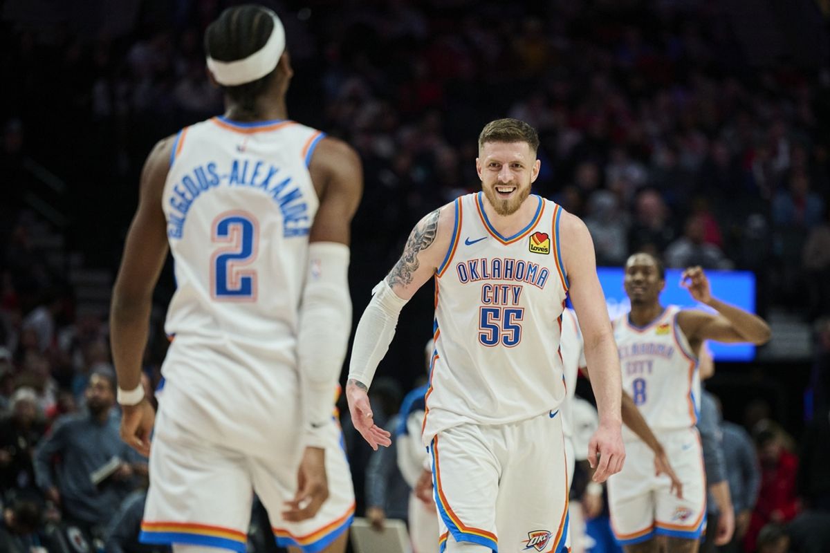 Jan 26, 2025; Portland, Oregon, USA; Oklahoma City Thunder center Isaiah Hartenstein (55) celebrates with guard Shai Gilgeous-Alexander (2) during a break in the second half against the Portland Trail Blazers at Moda Center. Mandatory Credit: Troy Wayrynen-Imagn Images