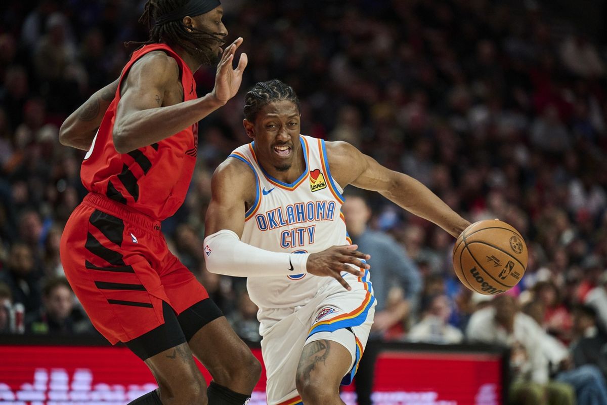 Jan 26, 2025; Portland, Oregon, USA; Oklahoma City Thunder forward Jalen Williams (8) drives to the basket during the second half against Portland Trail Blazers forward Jerami Grant (9) at Moda Center. Mandatory Credit: Troy Wayrynen-Imagn Images