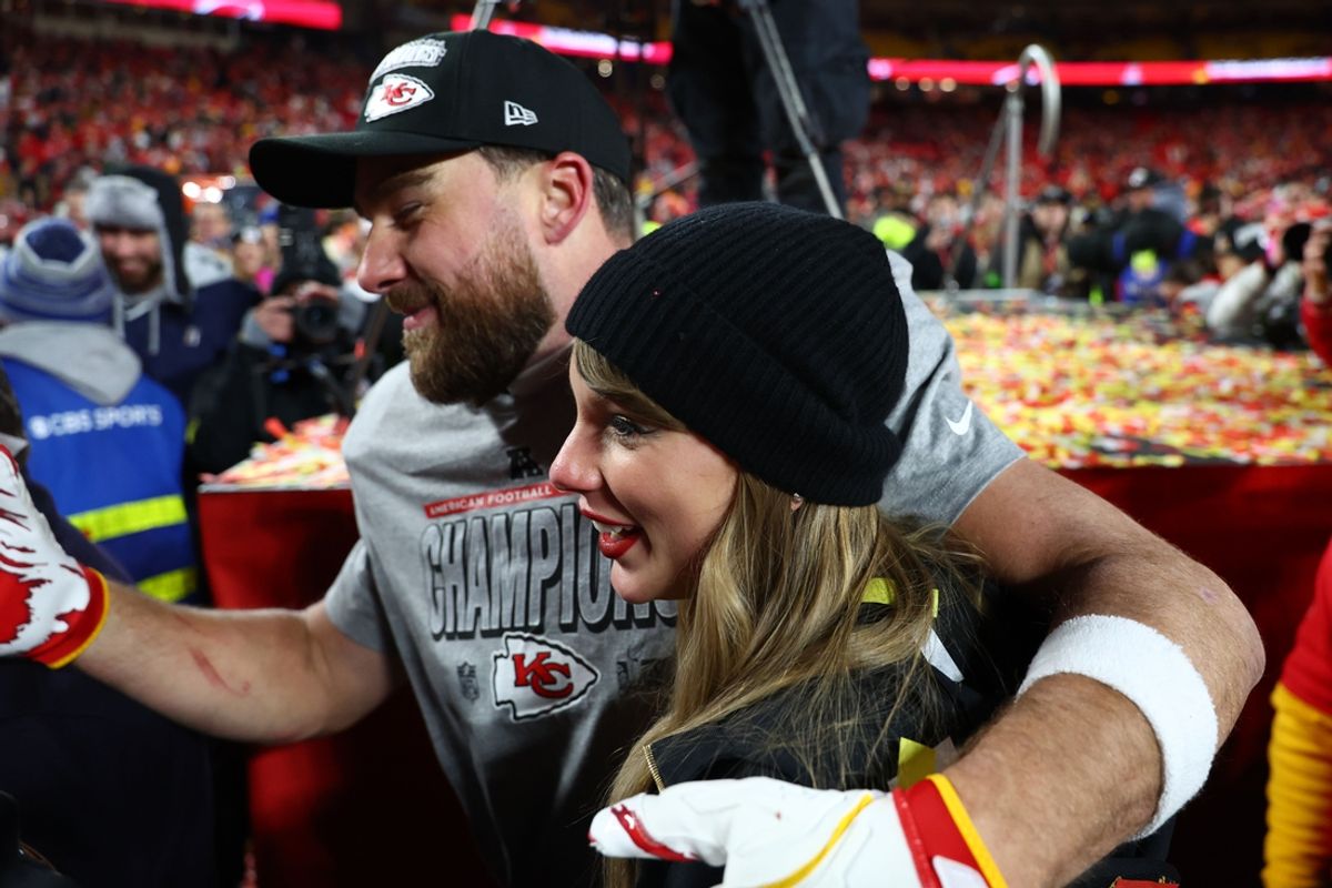 Jan 26, 2025; Kansas City, MO, USA; Recording artist Taylor Swift  and Kansas City Chiefs tight end Travis Kelce (87) react after the AFC Championship game against the Buffalo Bills at GEHA Field at Arrowhead Stadium. Mandatory Credit: Mark J. Rebilas-Imagn Images