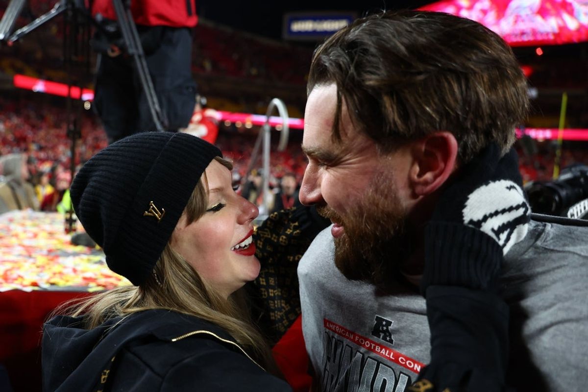 Jan 26, 2025; Kansas City, MO, USA; Recording artist Taylor Swift  and Kansas City Chiefs tight end Travis Kelce (87) react after the AFC Championship game against the Buffalo Bills at GEHA Field at Arrowhead Stadium. Mandatory Credit: Mark J. Rebilas-Imagn Images