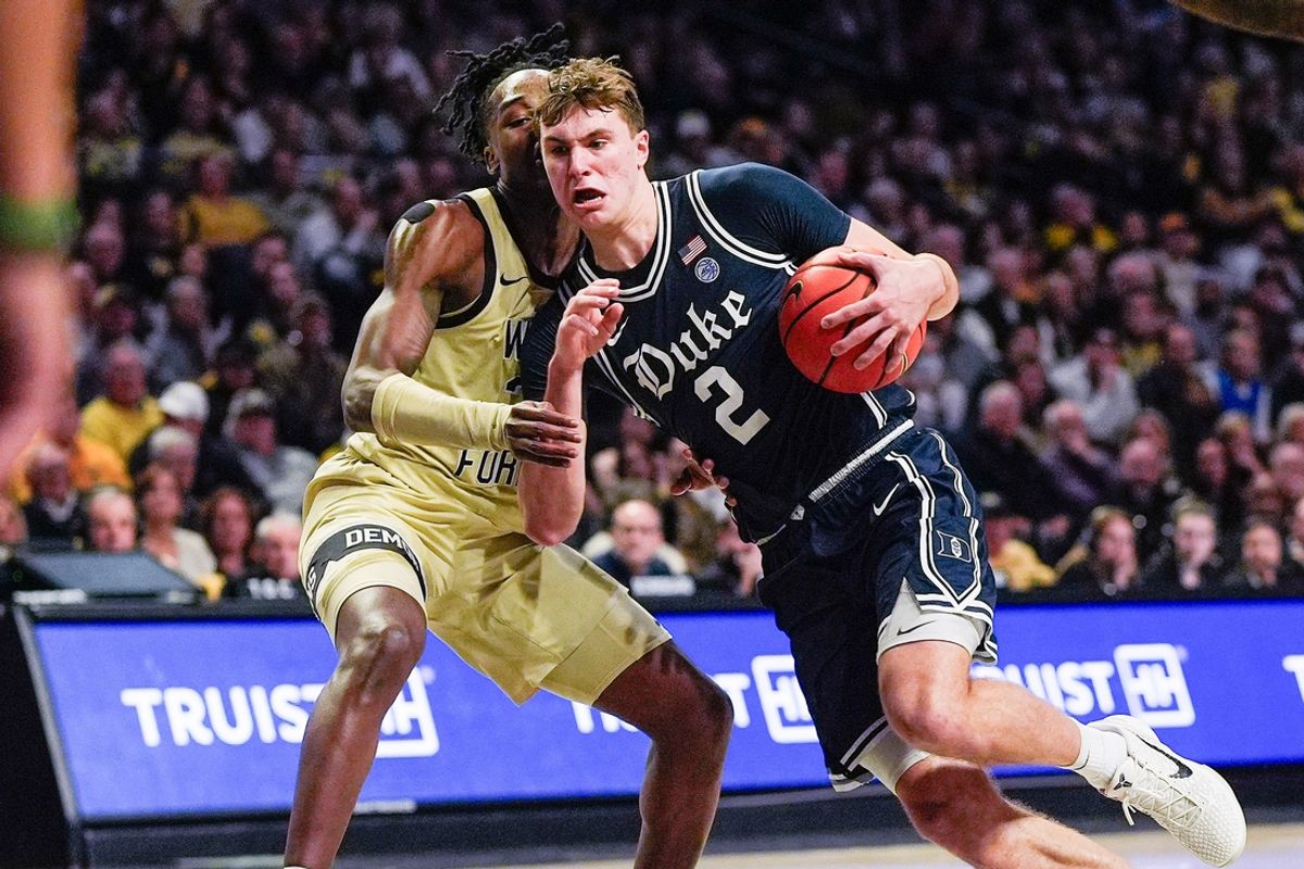 Jan 25, 2025; Winston-Salem, North Carolina, USA;  Duke Blue Devils guard Cooper Flagg (2) drives to the basket against Wake Forest Demon Deacons forward Tre'Von Spillers (25) during the second half at Lawrence Joel Veterans Memorial Coliseum. Mandatory Credit: Jim Dedmon-Imagn Images