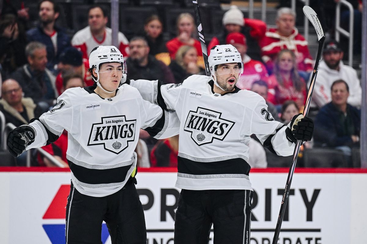 Jan 27, 2025; Detroit, Michigan, USA; Los Angeles Kings left wing Kevin Fiala (22) celebrates his goal with left wing Trevor Moore (12) during the first period against the Detroit Red Wings at Little Caesars Arena. Mandatory Credit: Tim Fuller-Imagn Images