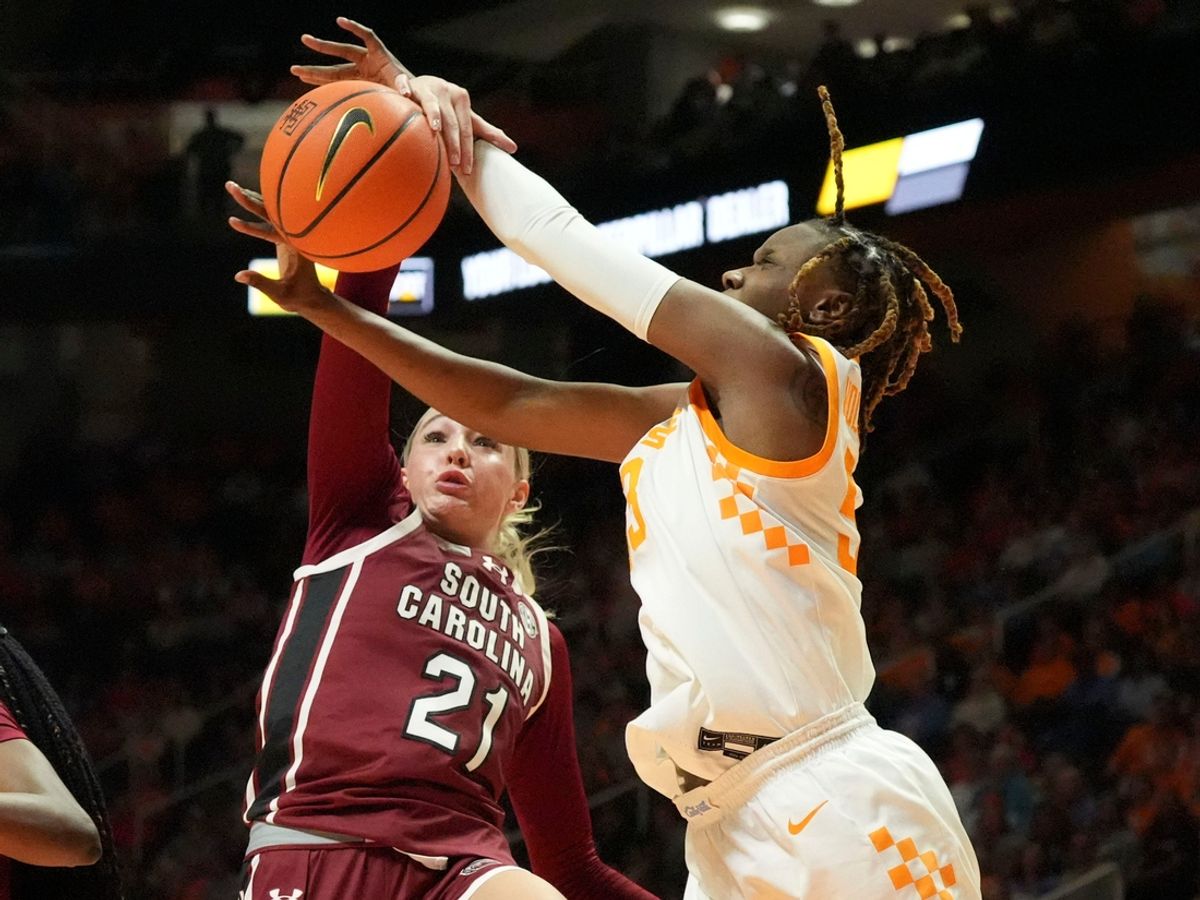 South Carolina's Chloe Kitts (21) and Tennessee's Jillian Hollingshead (53) battle for the rebound during an NCAA college basketball game on Monday, Jan. 27, 2025, in Knoxville, Tenn.