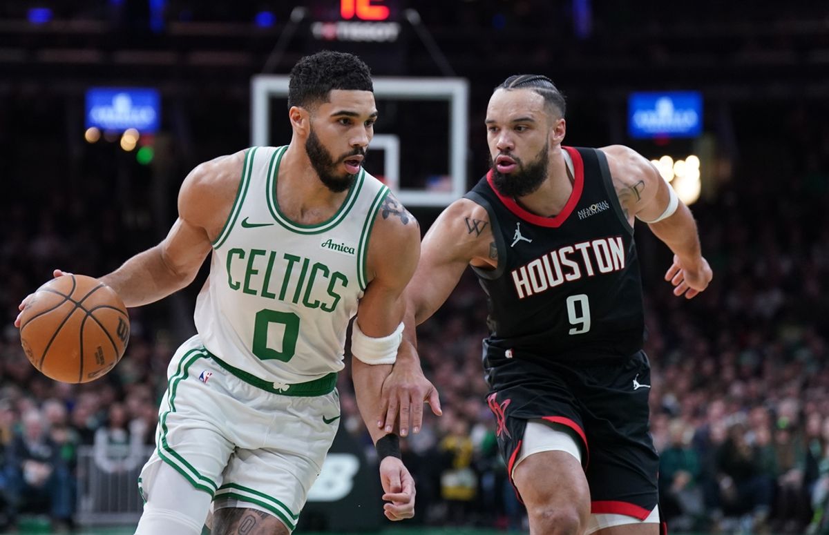 Jan 27, 2025; Boston, Massachusetts, USA; Boston Celtics forward Jayson Tatum (0) drives the ball against Houston Rockets forward Dillon Brooks (9) in the first quarter at TD Garden. Mandatory Credit: David Butler II-Imagn Images