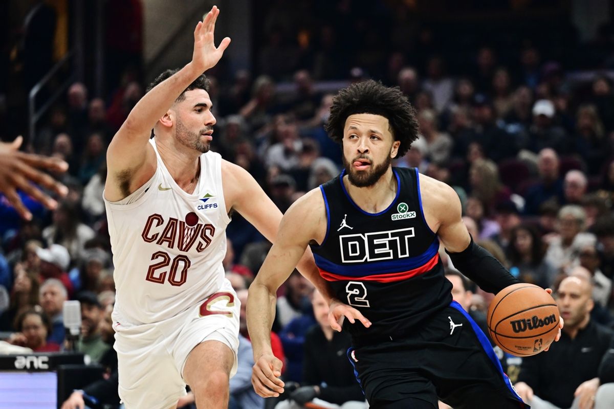 Jan 27, 2025; Cleveland, Ohio, USA; Detroit Pistons guard Cade Cunningham (2) drives to the basket against Cleveland Cavaliers forward Georges Niang (20) during the first half at Rocket Mortgage FieldHouse. Mandatory Credit: Ken Blaze-Imagn Images