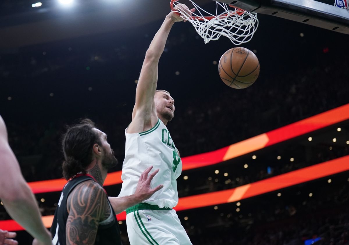 Jan 27, 2025; Boston, Massachusetts, USA; Boston Celtics center Kristaps Porzingis (8) makes the basket against the Houston Rockets in the second quarter at TD Garden. Mandatory Credit: David Butler II-Imagn Images