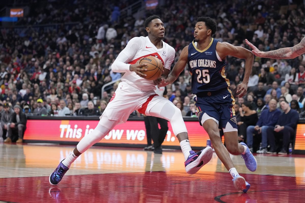 Jan 27, 2025; Toronto, Ontario, CAN; Toronto Raptors guard RJ Barrett (9) controls the ball as New Orleans Pelicans guard Trey Murphy III (25) defends during the first half at Scotiabank Arena. Mandatory Credit: John E. Sokolowski-Imagn Images