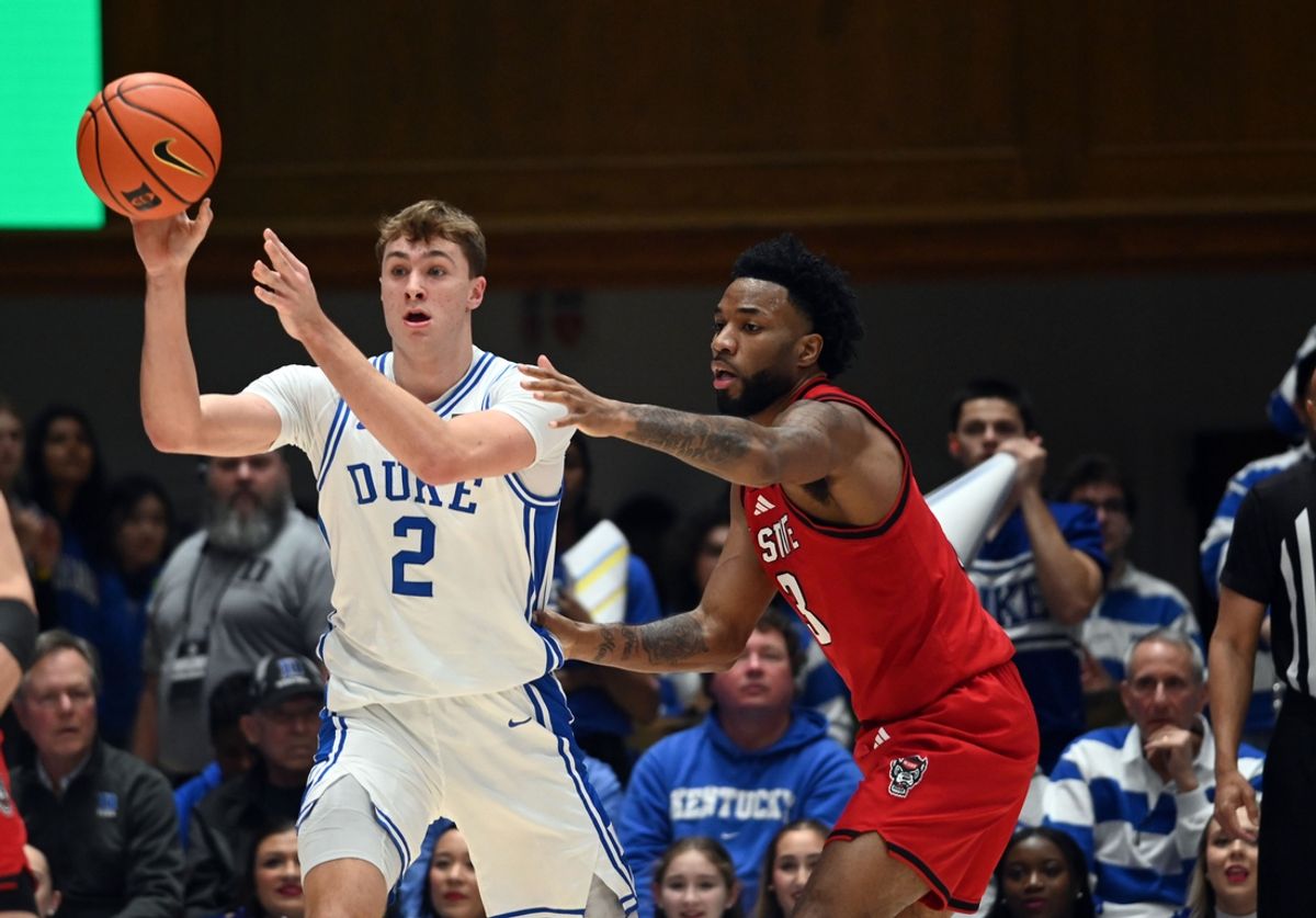 Jan 27, 2025; Durham, North Carolina, USA; Duke Blue Devils forward Cooper Flagg (2) throws a pass as North Carolina State Wolfpack guard Dontrez Styles (3) defends during the first half at Cameron Indoor Stadium. Mandatory Credit: Rob Kinnan-Imagn Images