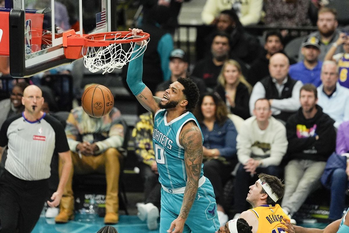 Jan 27, 2025; Charlotte, North Carolina, USA;  Charlotte Hornets forward Miles Bridges (0) goes up for a dunk against the Los Angeles Lakers during the second half at the Spectrum Center. Mandatory Credit: Jim Dedmon-Imagn Images