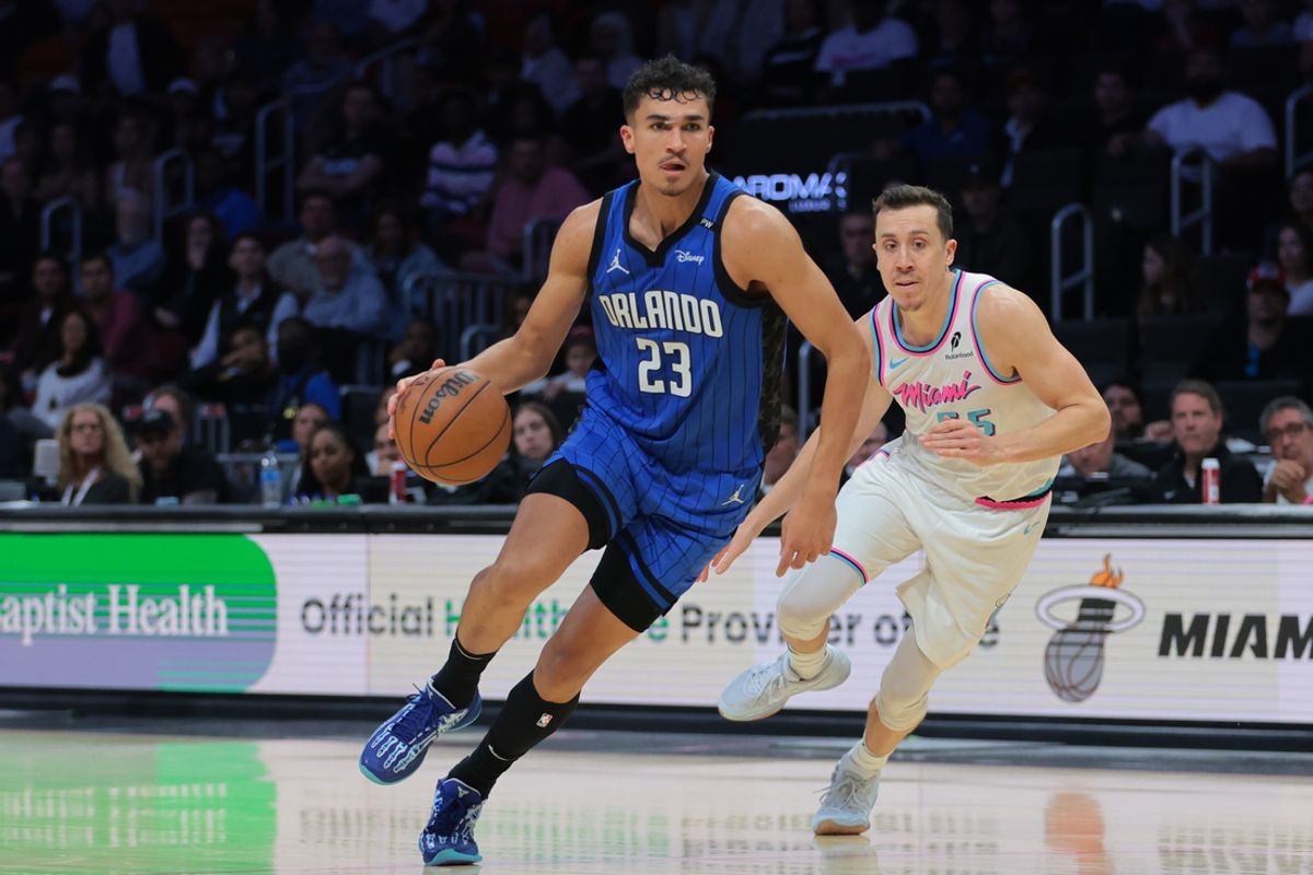 Jan 27, 2025; Miami, Florida, USA; Orlando Magic forward Tristan da Silva (23) drives to the basket past Miami Heat forward Duncan Robinson (55) during double overtime at Kaseya Center. Mandatory Credit: Sam Navarro-Imagn Images