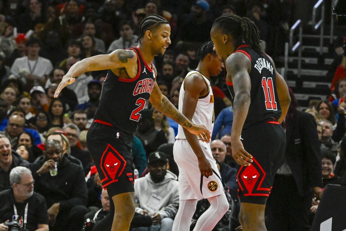 Jan 27, 2025; Chicago, Illinois, USA;  Chicago Bulls forward Dalen Terry (25) and guard Ayo Dosunmu (11) celebrate against the Denver Nuggets during the second half at the United Center. Mandatory Credit: Matt Marton-Imagn Images