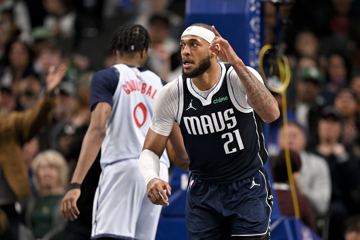 Jan 27, 2025; Dallas, Texas, USA; Dallas Mavericks center Daniel Gafford (21) celebrates after making a basket against the Washington Wizards during the second half at the American Airlines Center. Mandatory Credit: Jerome Miron-Imagn Images