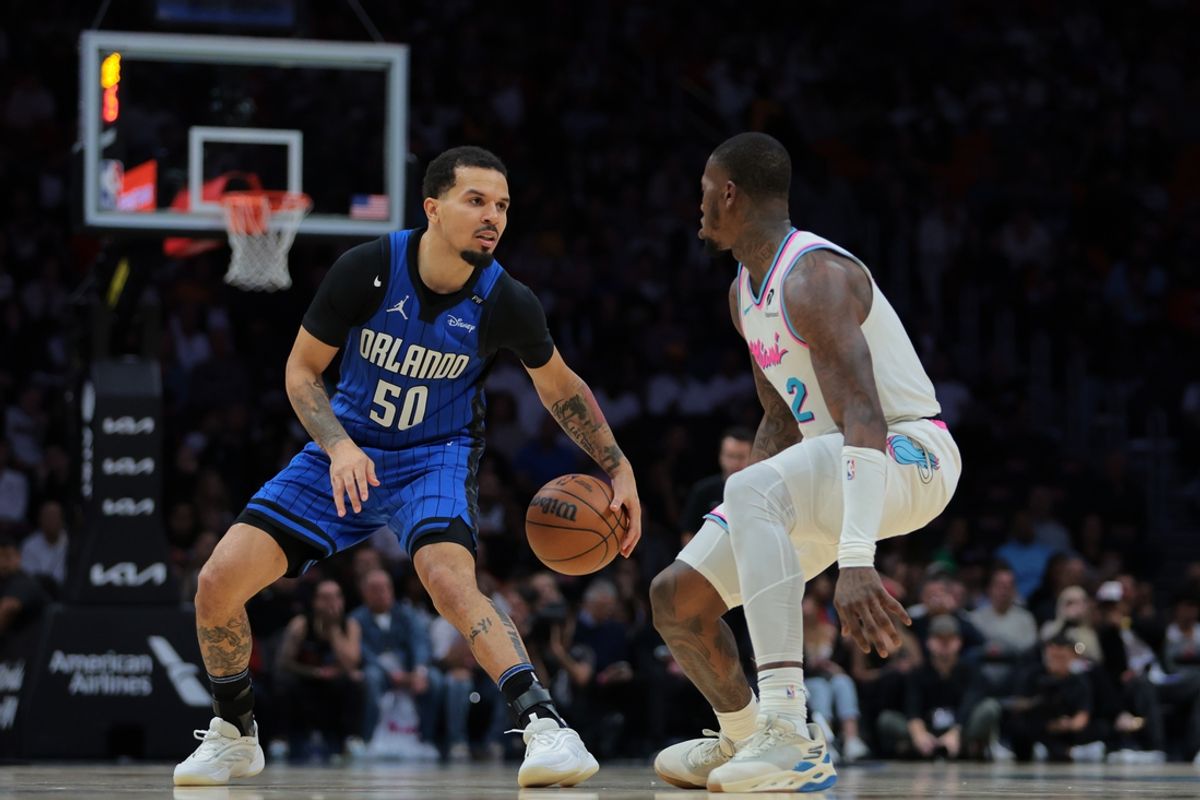 Jan 27, 2025; Miami, Florida, USA; Orlando Magic guard Cole Anthony (50) dribbles the basketball as Miami Heat guard Terry Rozier (2) defends during the fourth quarter at Kaseya Center. Mandatory Credit: Sam Navarro-Imagn Images