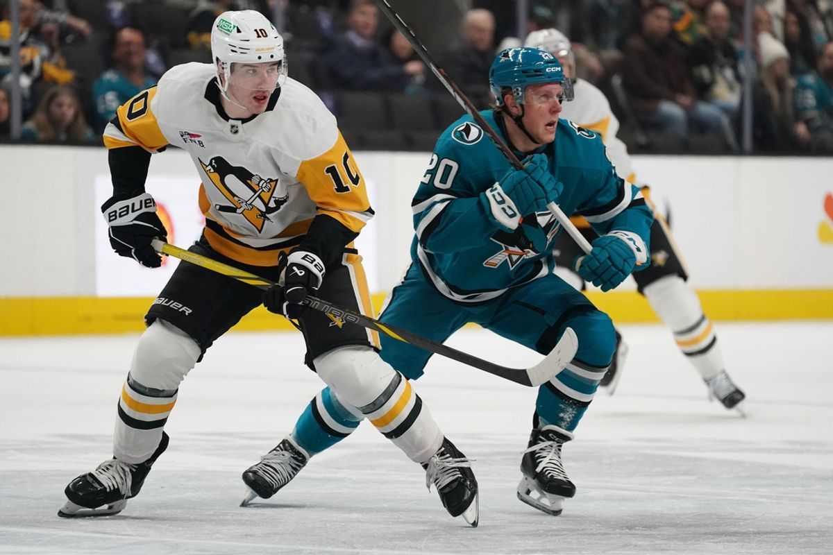 Jan 27, 2025; San Jose, California, USA;  Pittsburgh Penguins left winger Drew O'Connor (10) and San Jose Sharks left wing Fabian Zetterlund (20) follow the puck in the first period at SAP Center at San Jose. Mandatory Credit: David Gonzales-Imagn Images