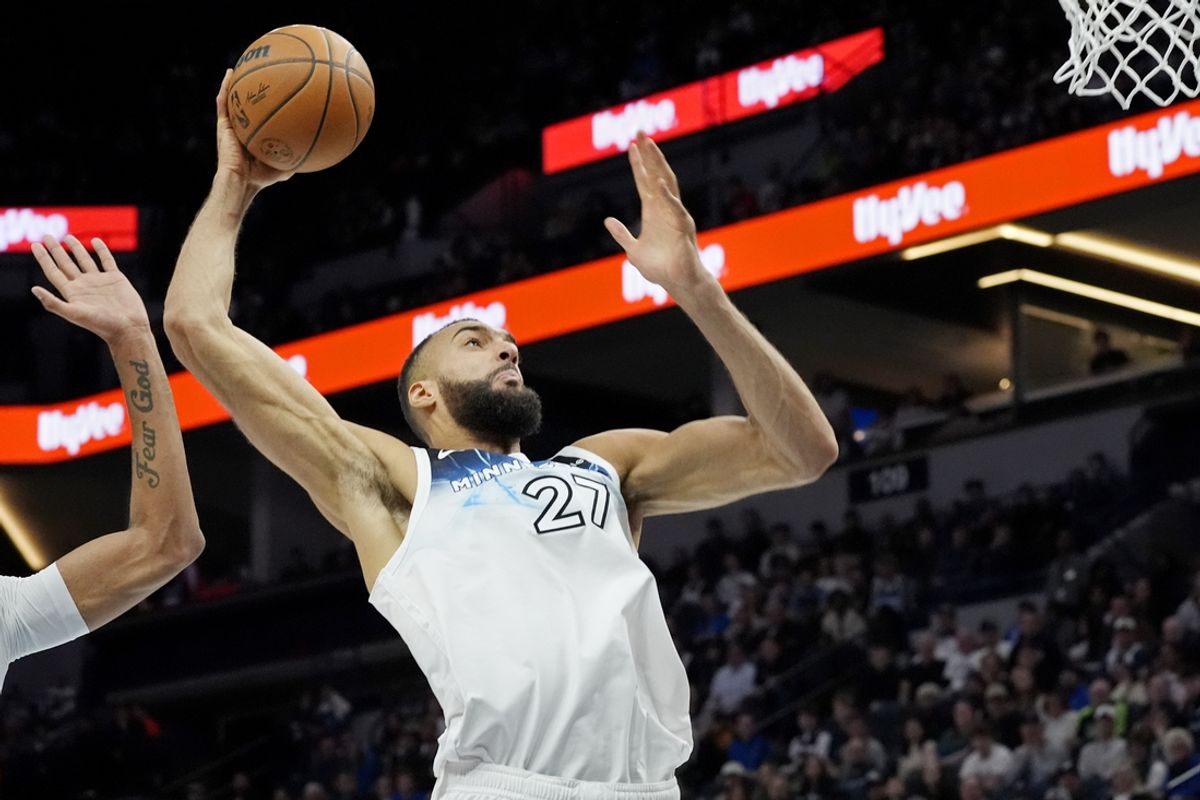 Jan 27, 2025; Minneapolis, Minnesota, USA; Minnesota Timberwolves center Rudy Gobert (27) dunks against the Atlanta Hawks in the fourth quarter at Target Center. Mandatory Credit: Bruce Kluckhohn-Imagn Images