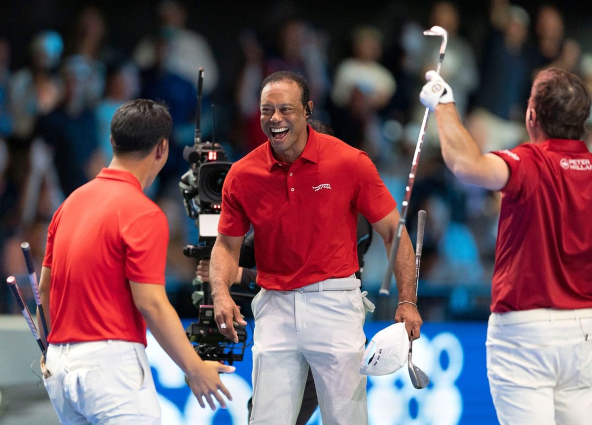 Tiger Woods of Jupiter Links celebrates the win with Tom Kim, left, and Kevin Kisner, right during a TGL match against Boston Common at the SoFi Center on January 27, 2025, in Palm Beach Gardens, Florida.