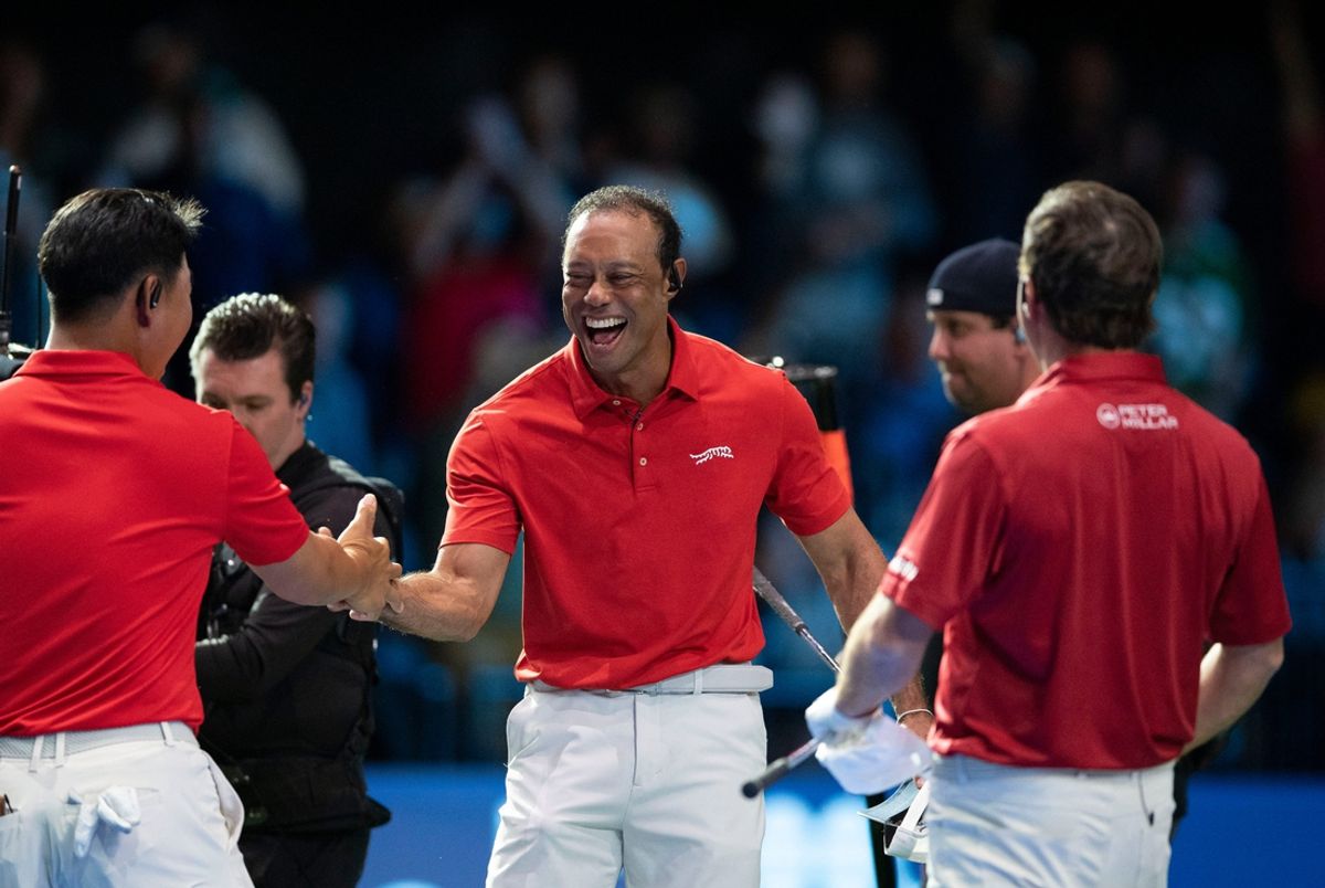 Tiger Woods of Jupiter Links celebrates the win with Tom Kim, left, and Kevin Kisner, right during a TGL match against Bottom Common at the SoFi Center on January 27, 2025, in Palm Beach Gardens, Florida.