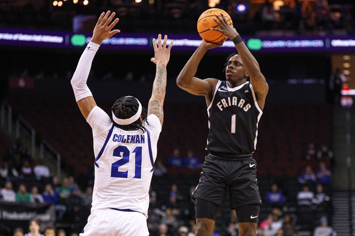 Jan 28, 2025; Newark, New Jersey, USA; Providence Friars guard Jayden Pierre (1) shoots the ball Seton Hall Pirates guard Isaiah Coleman (21) during the first half at Prudential Center. Mandatory Credit: Vincent Carchietta-Imagn Images