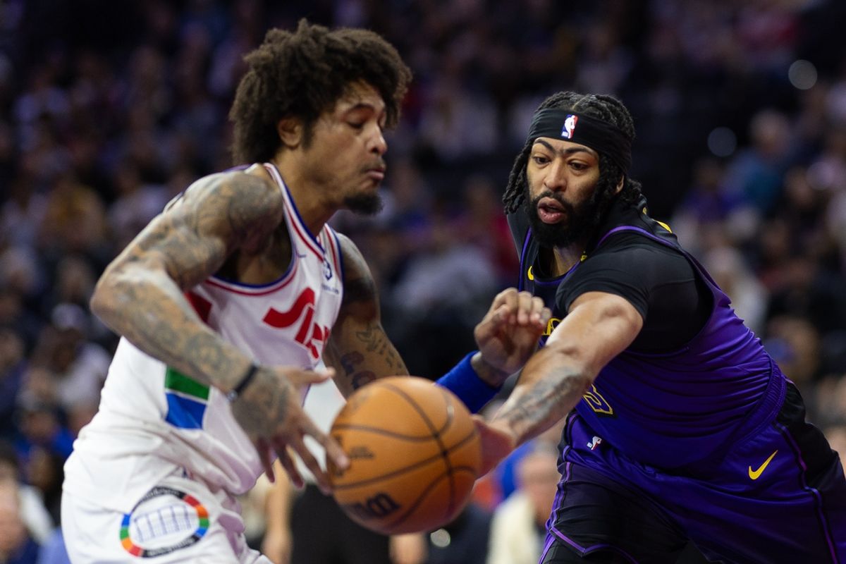 Jan 28, 2025; Philadelphia, Pennsylvania, USA; Los Angeles Lakers forward Anthony Davis (3) knocks the ball from Philadelphia 76ers guard Kelly Oubre Jr. (9) during the first quarter at Wells Fargo Center. Mandatory Credit: Bill Streicher-Imagn Images