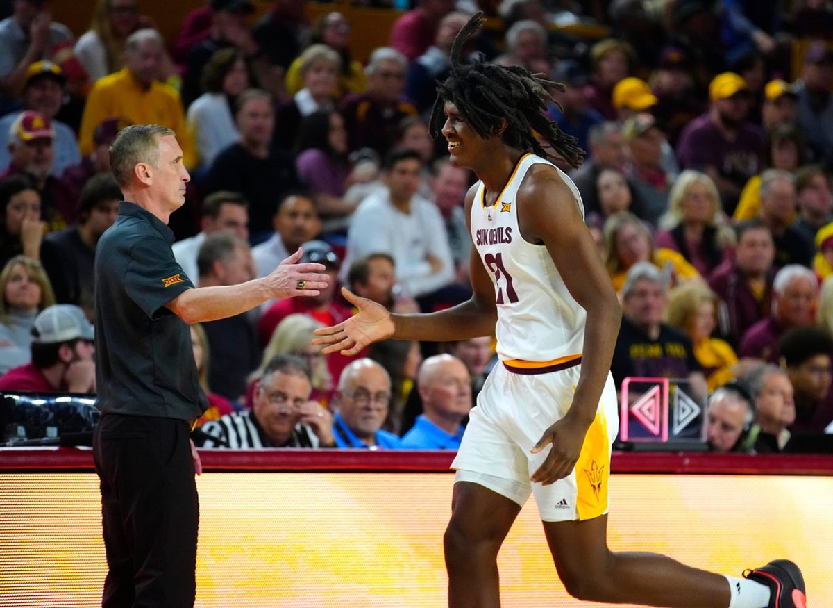 ASU head coach Bobby Hurley high-fives center Jayden Quaintance (21) as he comes to the bench during a game at Desert Financial Arena in Tempe on Jan. 25, 2025.