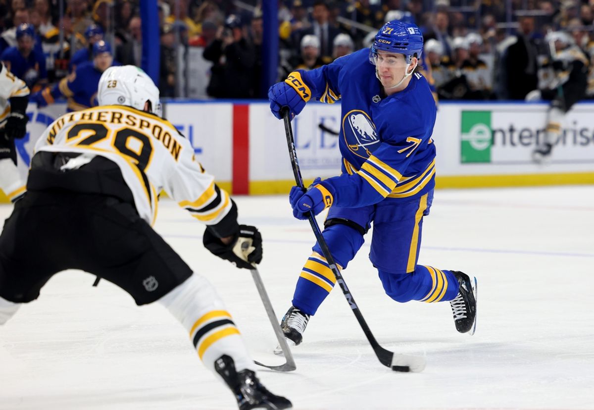 Jan 28, 2025; Buffalo, New York, USA;  Boston Bruins defenseman Parker Wotherspoon (29) tries to block a shot by Buffalo Sabres center Ryan McLeod (71) during the second period at KeyBank Center. Mandatory Credit: Timothy T. Ludwig-Imagn Images