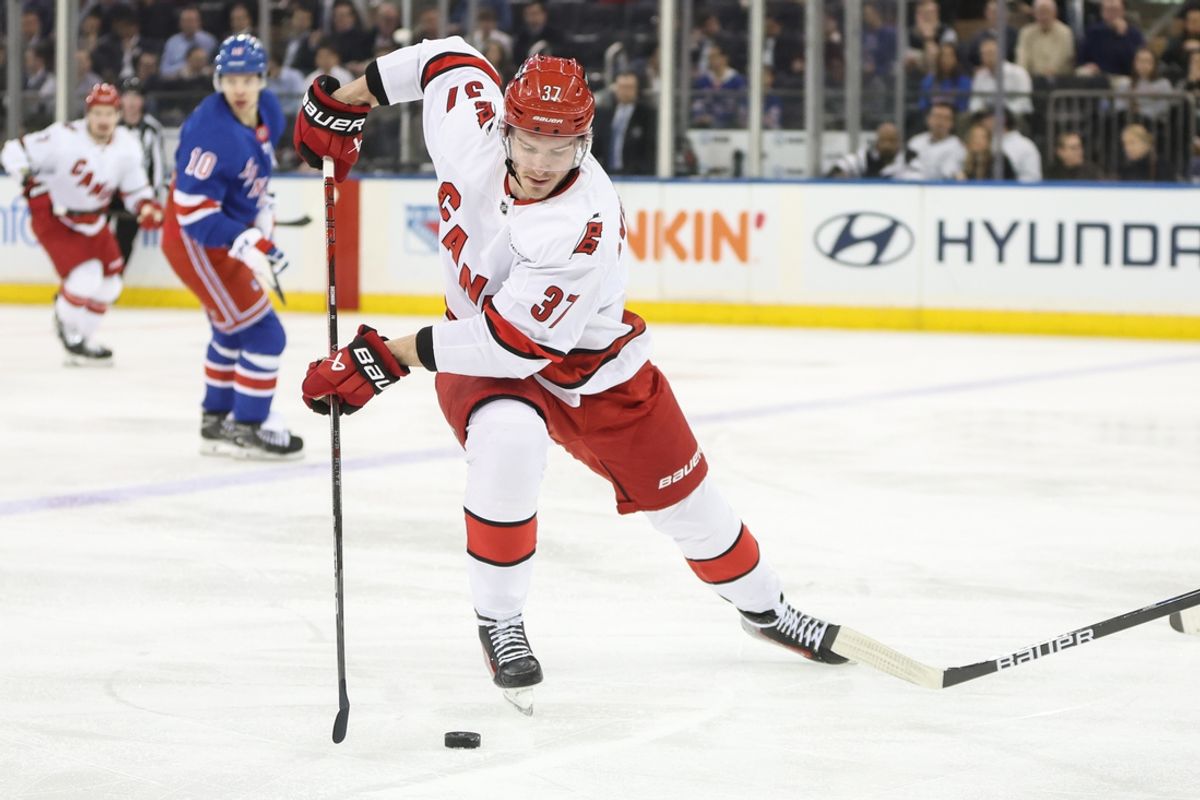 Jan 28, 2025; New York, New York, USA; Carolina Hurricanes right wing Andrei Svechnikov (37) controls the puck in the second period against the New York Rangers at Madison Square Garden. Mandatory Credit: Wendell Cruz-Imagn Images